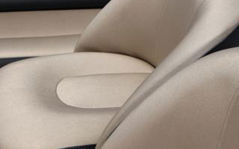 Close-up of a white leather yacht seat designed by Argola Textile Yacht Design, showcasing smooth texture, precise stitching, and a luxurious, minimalist design