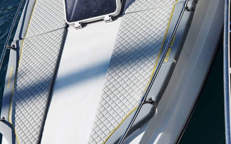 Close-up of premium leather upholstery on a yacht’s exterior seating, handcrafted by Dermavamvakakis