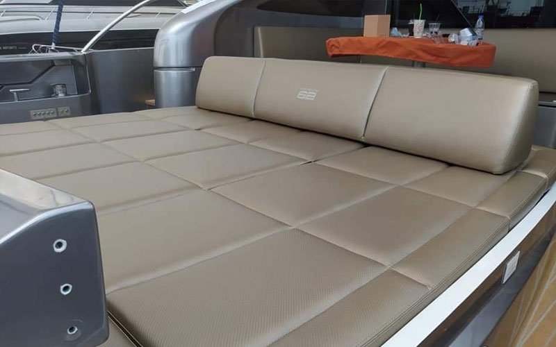 Close-up of premium leather upholstery on a yacht’s exterior seating, handcrafted by Dermavamvakakis