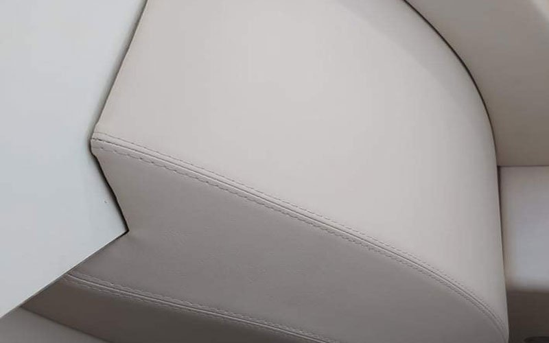 Close-up of premium leather upholstery on a yacht’s exterior seating, handcrafted by Dermavamvakakis