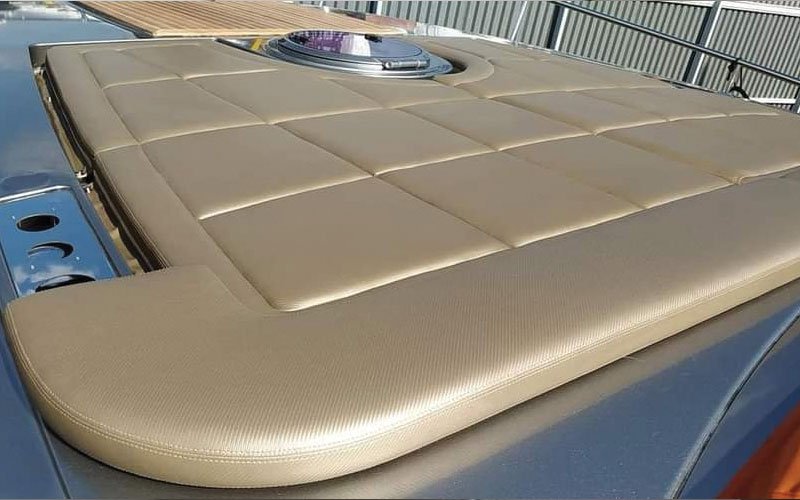 Close-up of premium leather upholstery on a yacht’s exterior seating, handcrafted by Dermavamvakakis