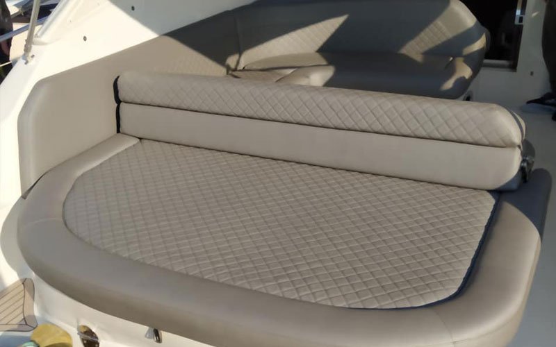 Close-up of premium leather upholstery on a yacht’s exterior seating, handcrafted by Dermavamvakakis