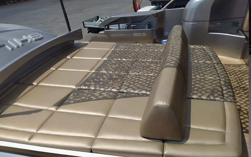 Close-up of premium leather upholstery on a yacht’s exterior seating, handcrafted by Dermavamvakakis
