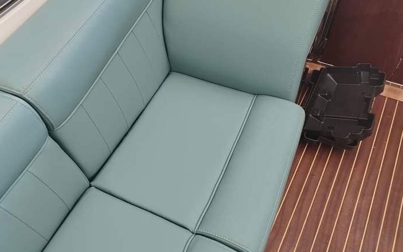 Close-up of premium leather upholstery on a yacht’s exterior seating, handcrafted by Dermavamvakakis
