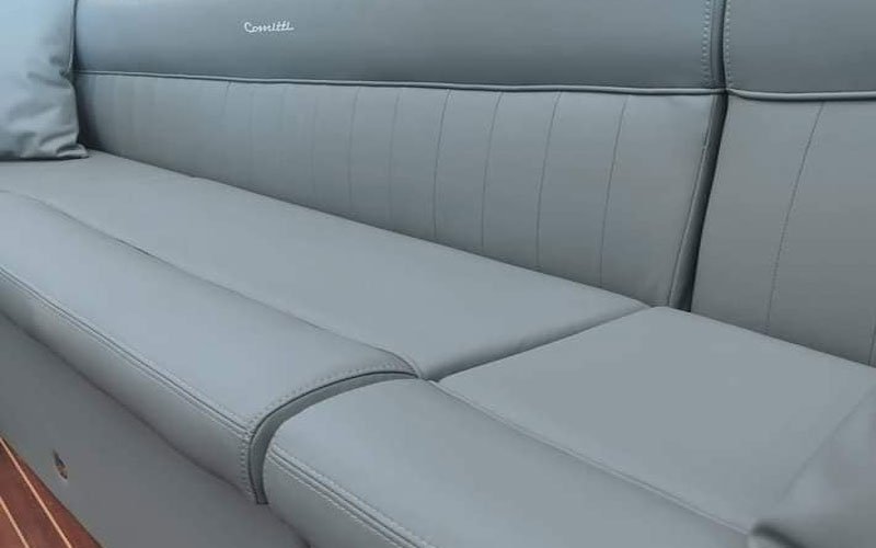 Close-up of premium leather upholstery on a yacht’s exterior seating, handcrafted by Dermavamvakakis