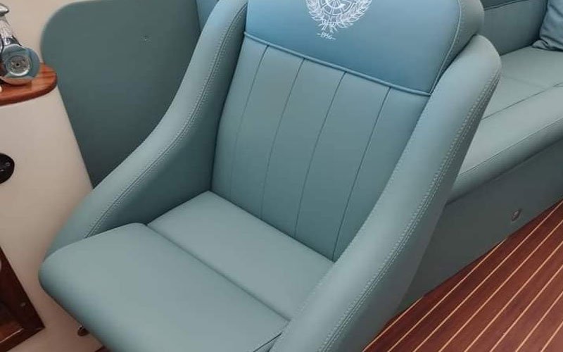 Close-up of premium leather upholstery on a yacht’s exterior seating, handcrafted by Dermavamvakakis