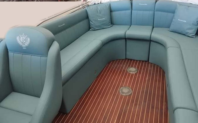 Close-up of premium leather upholstery on a yacht’s exterior seating, handcrafted by Dermavamvakakis