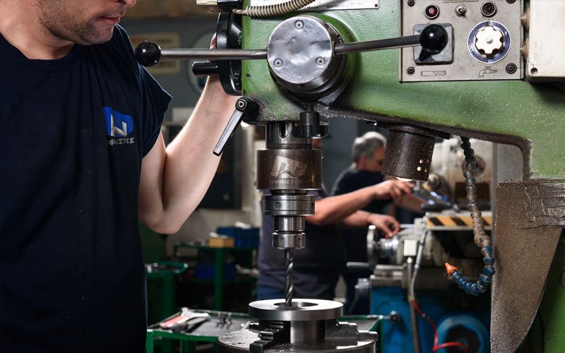 Vertical drilling and machining process for metal components at General Constructions Ifaistus woekshop