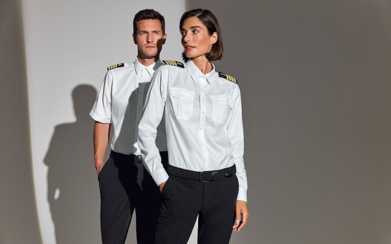 Men and women wearing Marinepool premium maritime and sailing apparel, showcasing professional nautical clothing designed for performance, comfort, and modern style.