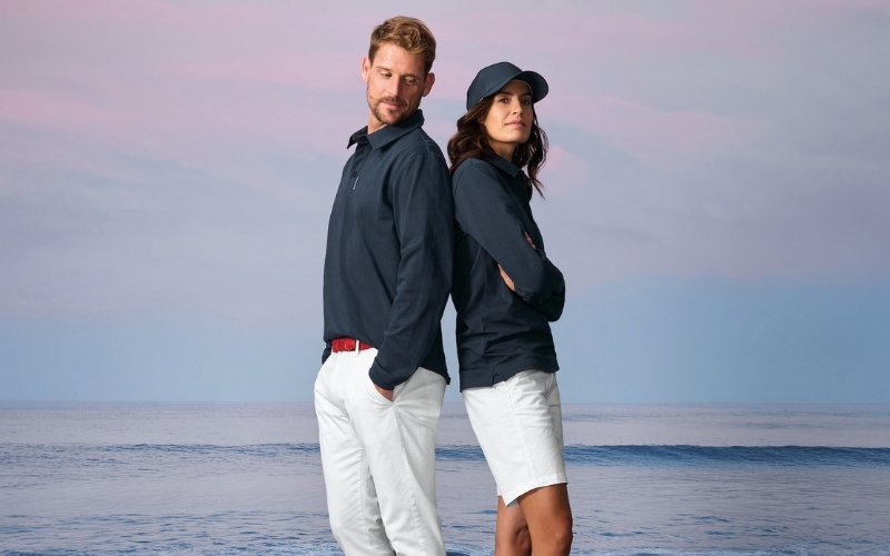 Men and women wearing Marinepool premium maritime and sailing apparel, showcasing professional nautical clothing designed for performance, comfort, and modern style.