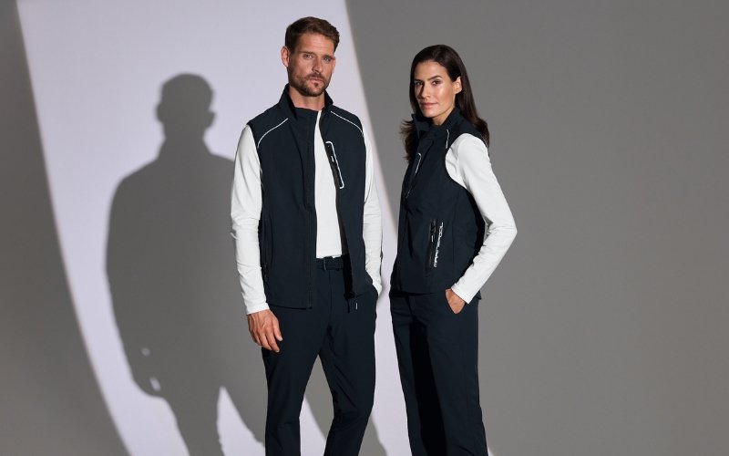 Men and women wearing Marinepool premium maritime and sailing apparel, showcasing professional nautical clothing designed for performance, comfort, and modern style.