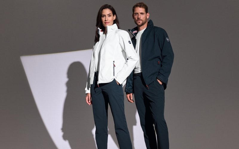Men and women wearing Marinepool premium maritime and sailing apparel, showcasing professional nautical clothing designed for performance, comfort, and modern style.