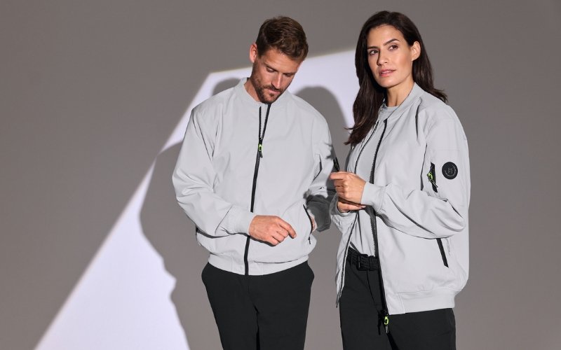 Men and women wearing Marinepool premium maritime and sailing apparel, showcasing professional nautical clothing designed for performance, comfort, and modern style.