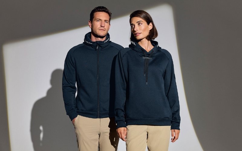 Men and women wearing Marinepool premium maritime and sailing apparel, showcasing professional nautical clothing designed for performance, comfort, and modern style.
