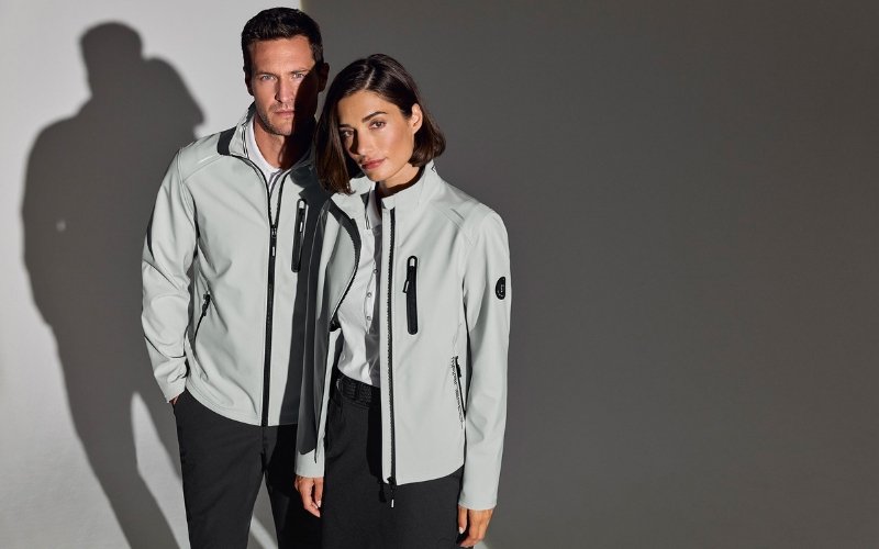 Men and women wearing Marinepool premium maritime and sailing apparel, showcasing professional nautical clothing designed for performance, comfort, and modern style.