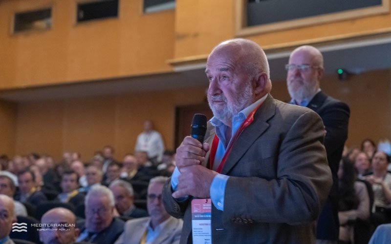 Audience member asking a question during Q&A session at the Mediterranean Superyacht Forum