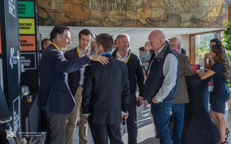 Industry professionals networking during a break at the Mediterranean Superyacht Forum