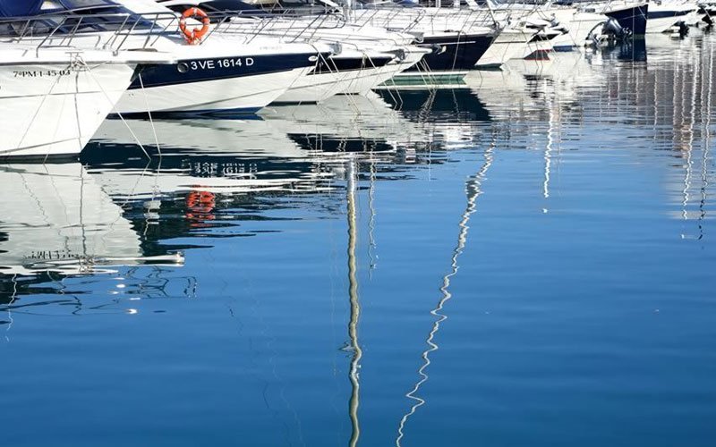 Luxury marina facilities managed by OCIBAR Group featuring superyachts, modern berths, waterfront promenades, and premium coastal infrastructure in top Mediterranean destinations.