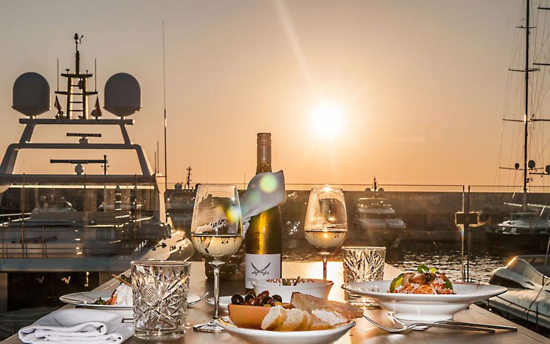 Luxury marina facilities managed by OCIBAR Group featuring superyachts, modern berths, waterfront promenades, and premium coastal infrastructure in top Mediterranean destinations.