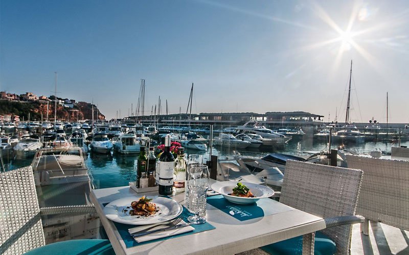 Luxury marina facilities managed by OCIBAR Group featuring superyachts, modern berths, waterfront promenades, and premium coastal infrastructure in top Mediterranean destinations.