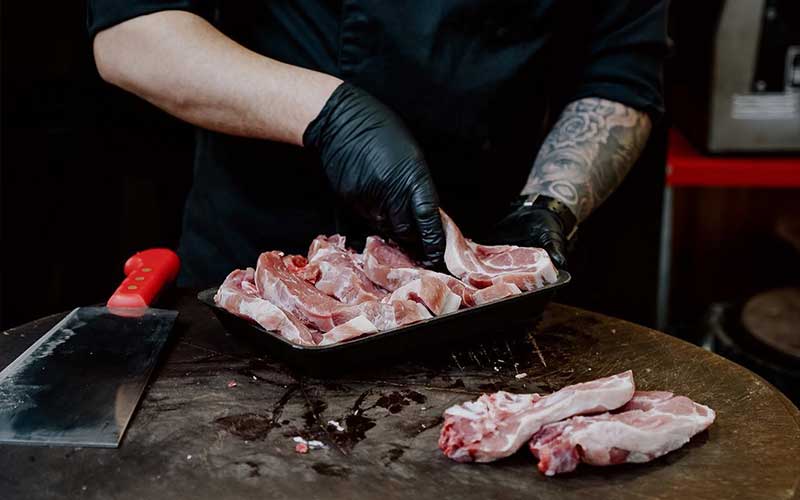 SOUVATZOGLOU Yacht Meat Delivery expert butcher preparing fresh premium meat for yacht delivery