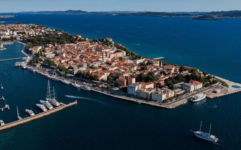 Aerial view of Adriatic coastal town showcasing maritime destination for Adriatic Nautical Business Forum